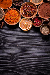 spices and herbs on wooden table.