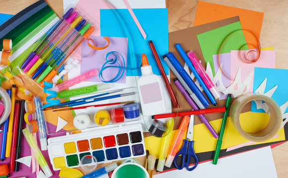 artwork workplace with creative accessories, art tools for painting and drawing