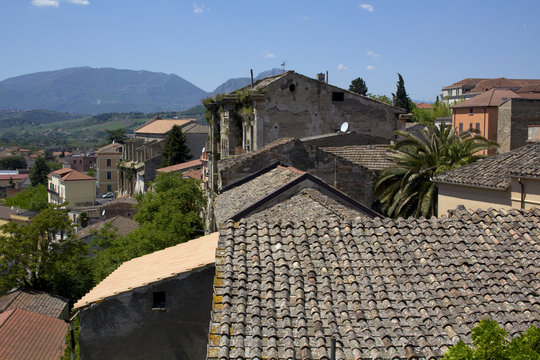 Rustic buildings in Benevento, Campania, Italy and Taburno Mountains in background.