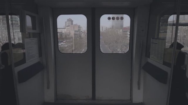 View of doors of the express subway train carriage. Transit or transportation system in Beijing, China.Handheld shot with foreground.