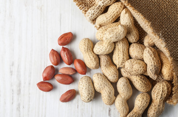 Peanuts in shells on wood