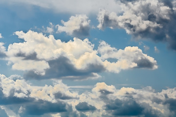 Picturesque gray cumulus clouds in the blue sky