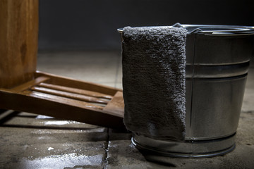 Torture chamber with a water bucket for controversial waterboarding