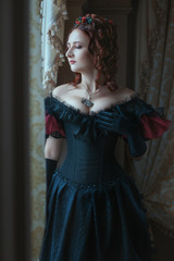 Graceful woman at the window.