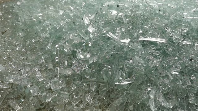 shards of glass falling into a pile in slow motion