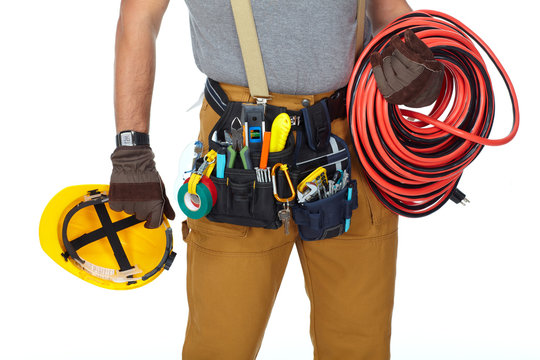 Electrician with construction tools and cable.