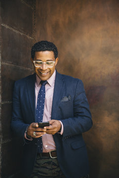 Portrait of mature businessman with smartphone