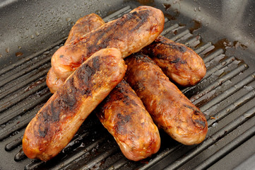 Fried Pork Sausages In A Griddle Frying Pan