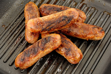 Fried Pork Sausages In A Griddle Frying Pan