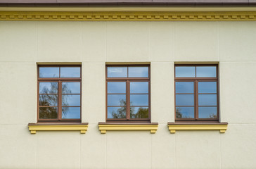 The window in the building. Three windows.
