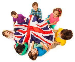 Kids with English flag in a middle of their circle