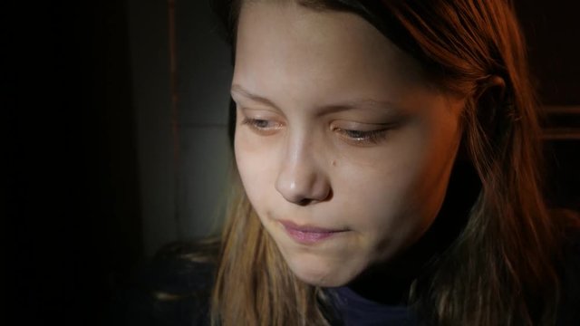 Young teen girl in the dark, UHD 4K