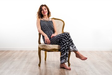 Model woman on vintage armchair