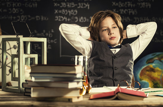 Bored student sitting at desk in classroom