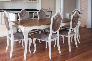 Dining room with classic chairs and wooden table