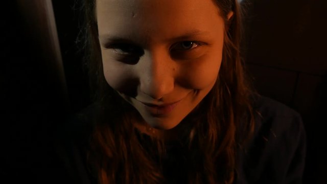 Evil demonic teen girl with a sinister smile, 4K UHD