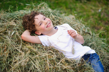baby lying on the hay © unguryanu