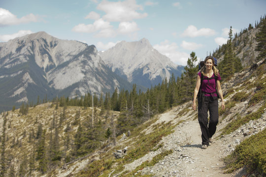 Caucasian woman hiking on remote hillside