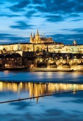 Prague Castle with surrounding buildings across the river