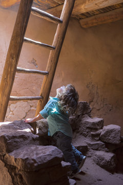 Caucasian girl exploring Native American ruins at Pecos National Monument, Pecos, New Mexico, United States