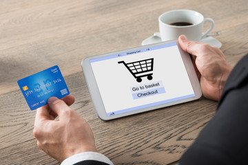 Close-up Of Businessman Shopping Online