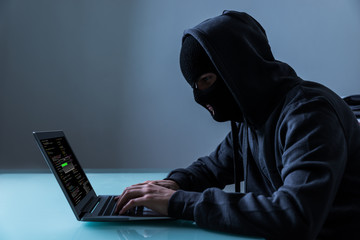 Hacker Stealing Information From Laptop