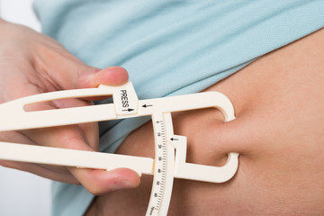 Man Measuring Stomach Fat