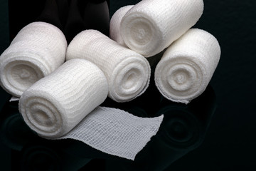Medical bandage on black background