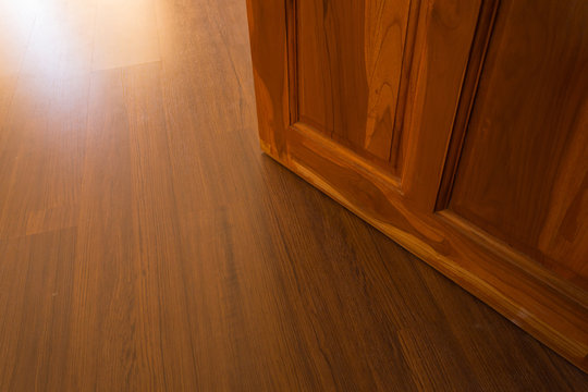 wood laminate floor and wooden door open