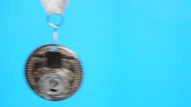  silver medal on a blue background