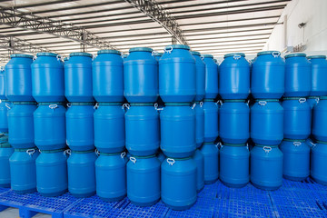 Blue Plastic barrels contain