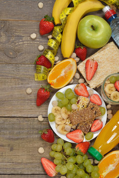 Fruits and cereals on a wooden background