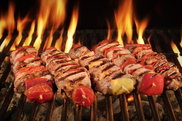 Many Shish Kebab On The BBQ Flaming Charcoal Grill © Alex