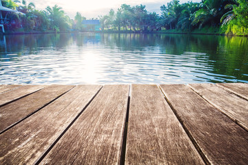antique wooden pier on the lake with sunlight effects