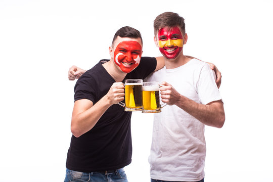 Spain and Turkey football fan drink beer on white background. European football fans concept.