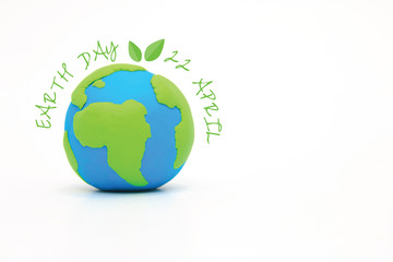 Globe ,earth made from clay on white background with copy space. Concept Save green planet at April 22