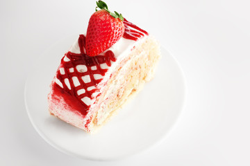 Strawberry cake on white plate