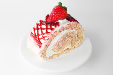 Strawberry cake on white plate