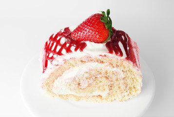 Strawberry cake on white plate