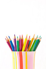 Group of color pencils in a colorful cup