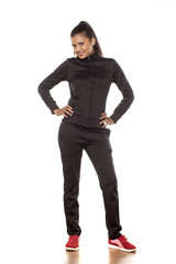 Fototapeta premium young pretty woman in tracksuits posing in the studio