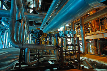 Equipment, cables and piping as found inside of a modern industr
