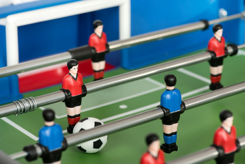 Close up of figures and ball in foosball table