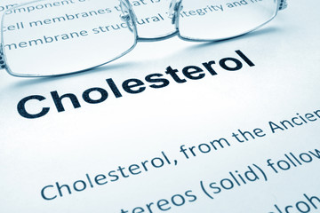 Paper with word cholesterol   and glasses.