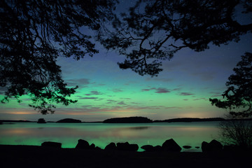 Scenic view of a lake landscape with northern lights