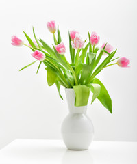 Bright spring bouquet in a vase. Springtime. Vase with tulips.