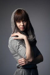 beautiful girl with knitted scarf portrait