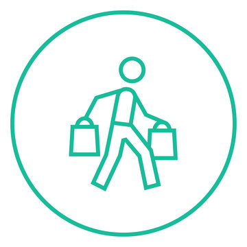 Man carrying shopping bags line icon.