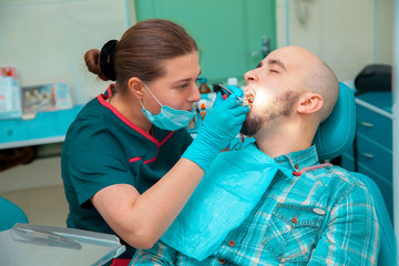 the guy at the dentist treats teeth