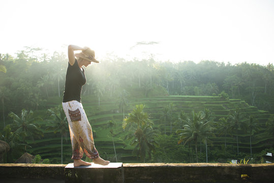 Caucasian tourist over rural rice terrace, Ubud, Bali, Indonesia